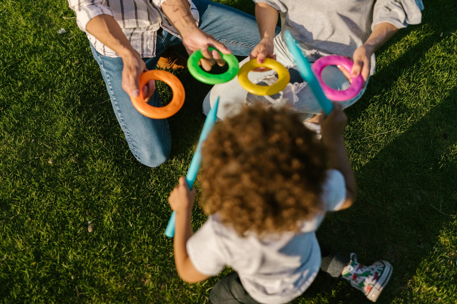 Playful Indian family interacting outdoors, positive development context